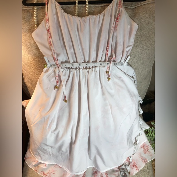 White dress with red detail. Adjustable tie straps with gold accent beads. - Picture 6 of 8